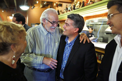 U.S. Rep. Cory Gardner, center right, who is running for the U.S. Senate, talks with supporter Don Trujillo during a meeting and a press conference with state Republican Hispanics, at a Mexican restaurant in Aurora, Colo., Wednesday, Sept. 24, 2014. (AP Photo/Brennan Linsley) U.S. Rep. Cory Gardner, center right, who is running for the U.S. Senate, talks with supporter Don Trujillo during a meeting and a press conference with state Republican Hispanics, at a Mexican restaurant in Aurora, Colo., Wednesday, Sept. 24, 2014. (AP Photo/Brennan Linsley)